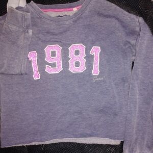Juniors Pink 1981 Guess Crop Sweatshirt.
